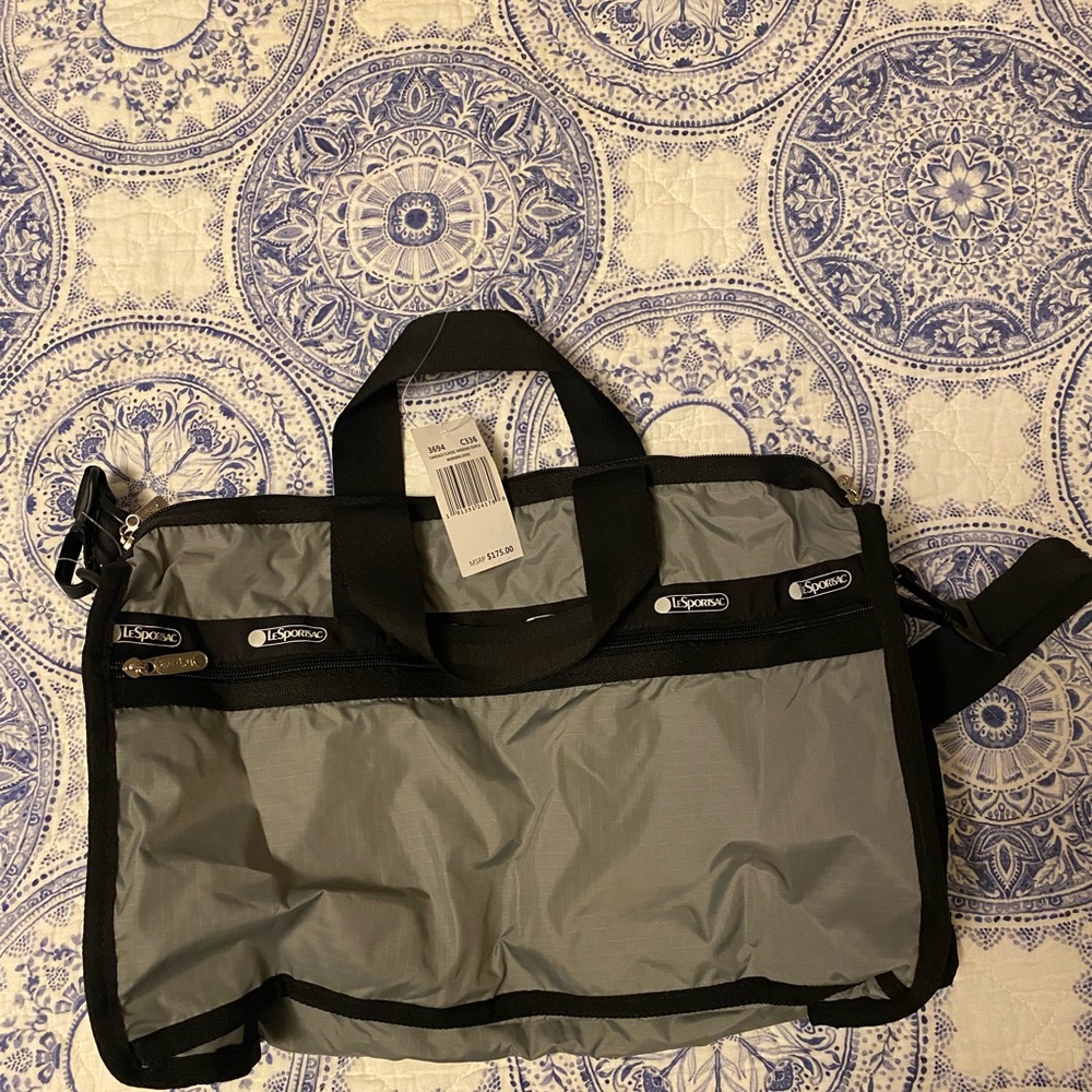 Candance classic duffle effortlessly holds your belongings w/ pockets & straps